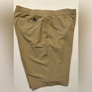 Men’s adidas size 38 waist 10.5 in seam golf shorts, tan in color.